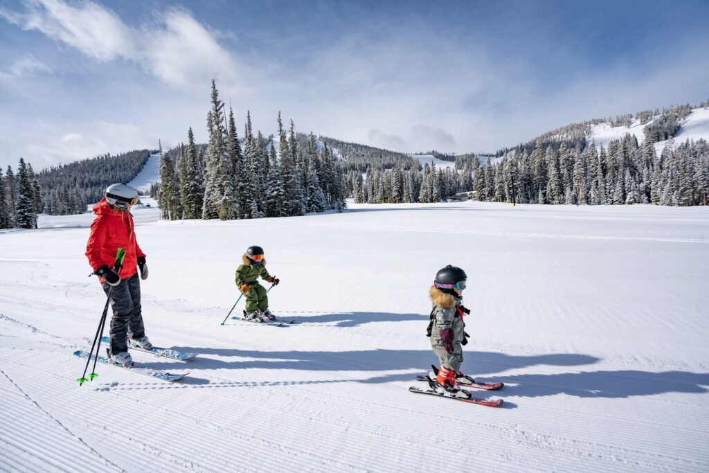 Family of skiers together at Winter Park