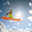 Woman catching air on a ski jump on a sunny day