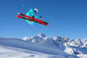 Skier catching air on a bluebird day
