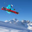 Skier catching air on a bluebird day