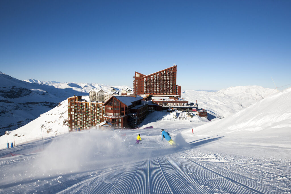 Skiing down groomed runs at Valle Nevado Ski Resort