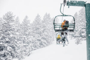 Snowing while people go up chairlift at Sun Valley