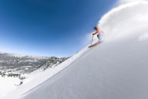 Skiing through powder on a bluebird day in Utah