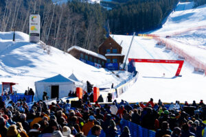 Skier crossing finish line at Birds of Prey Competition at Beaver Creek