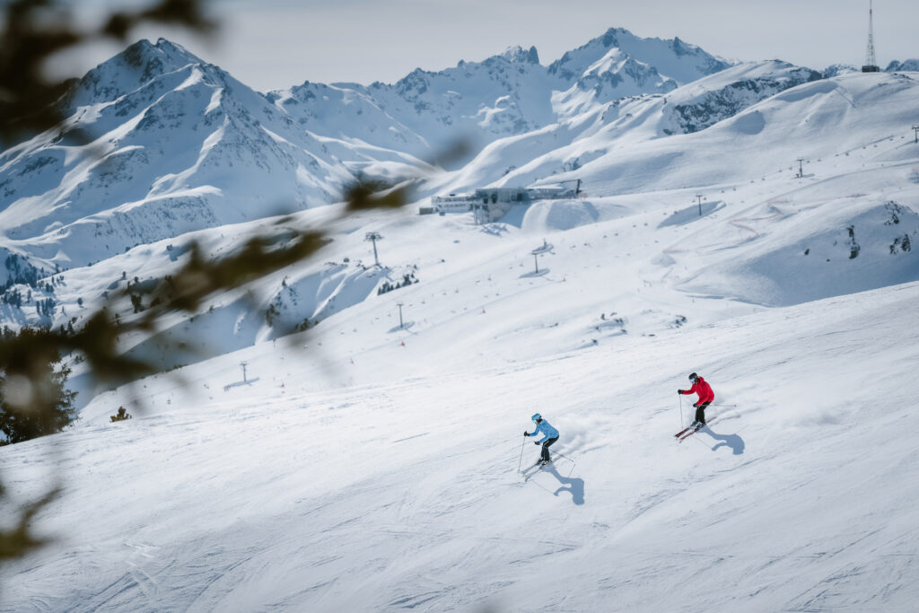 Skiers skiing down runs at The Arlberg