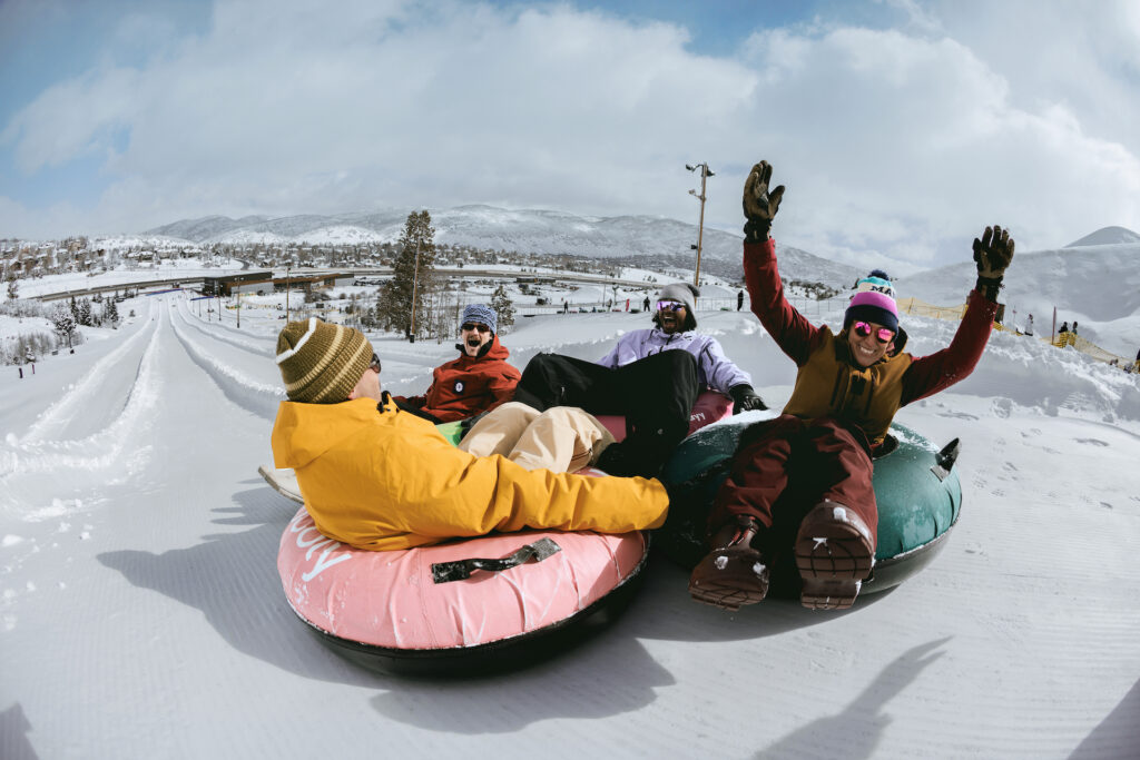 Group of friends going snow tubing in Utah
