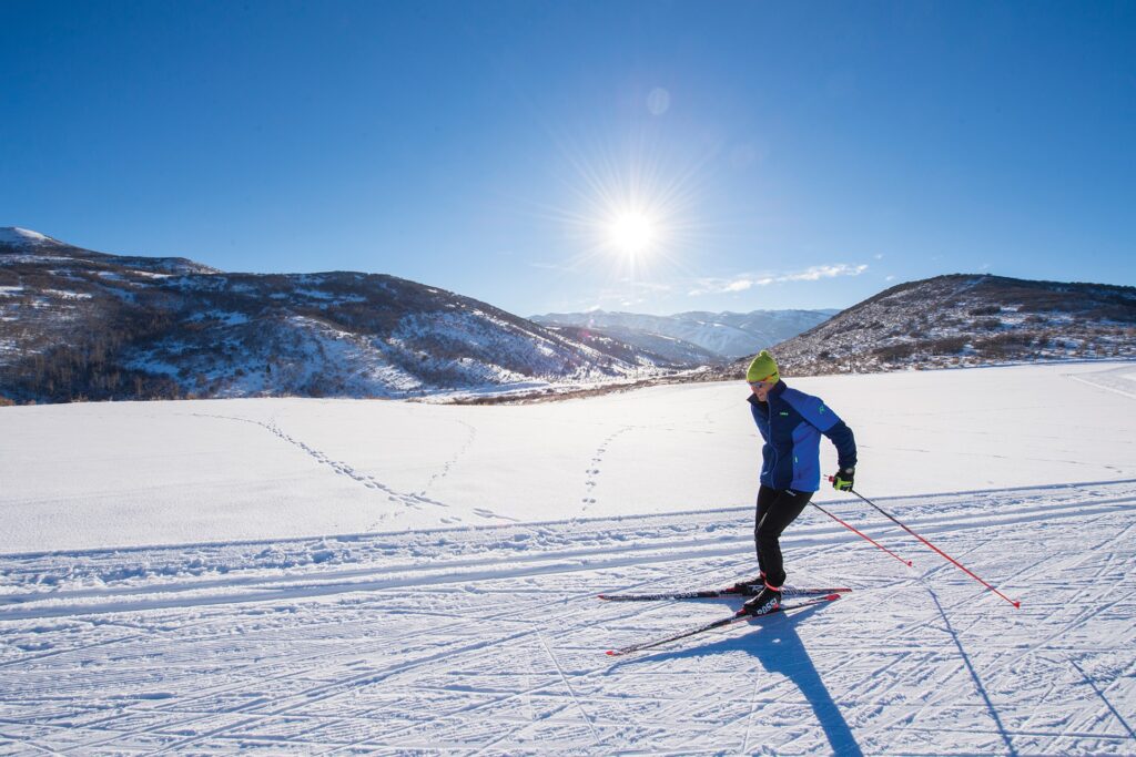 Person cross-country skiing on a sunny day