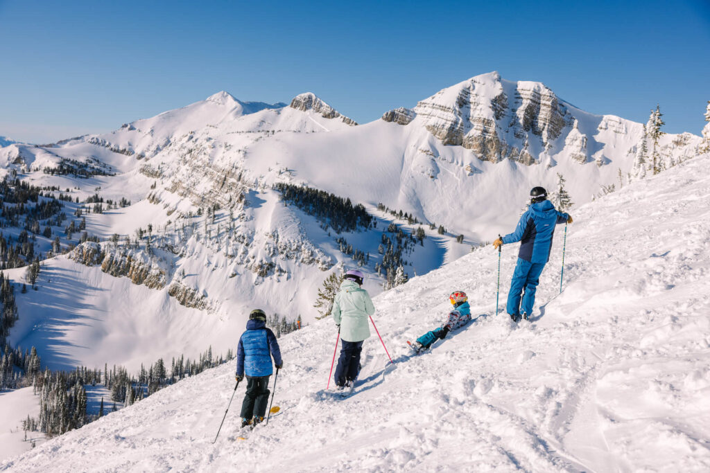Family taking a break on the slopes of Jackson Hole on a sunny day