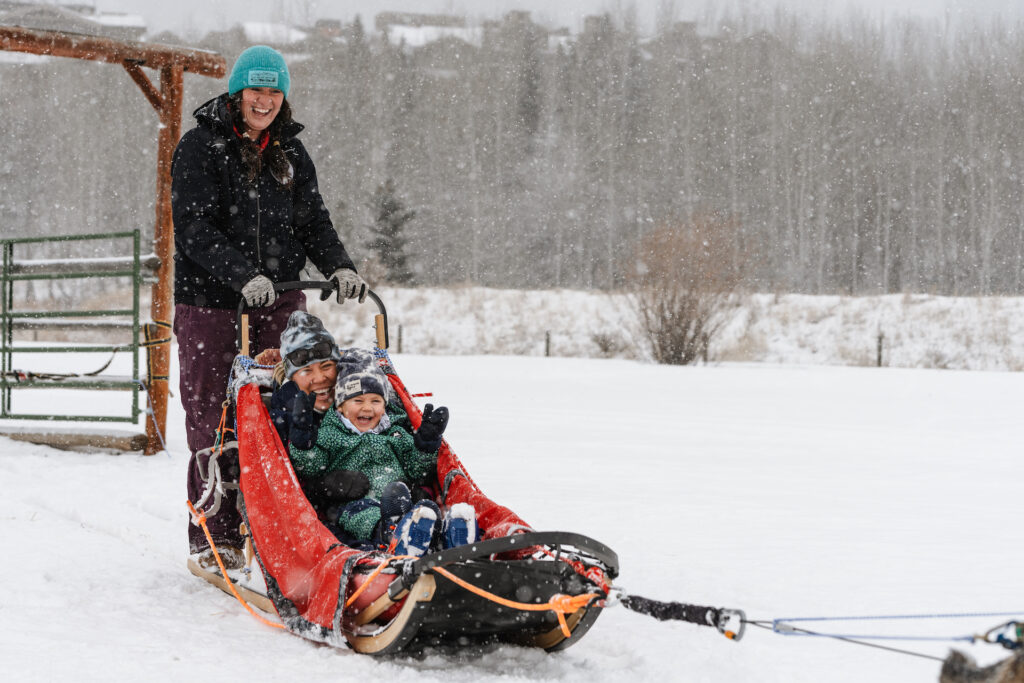Family going on sleigh ride at Jackson Hole