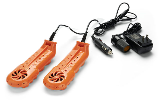 The DryGuy Travel Dry DX Boot Dryer and charger on a white table