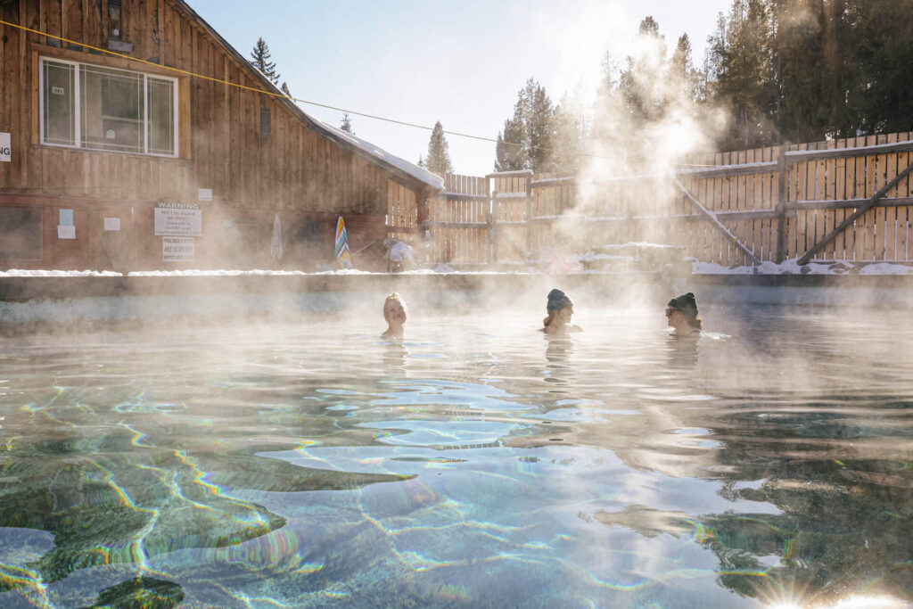 Group soaking in hot springs in Montana