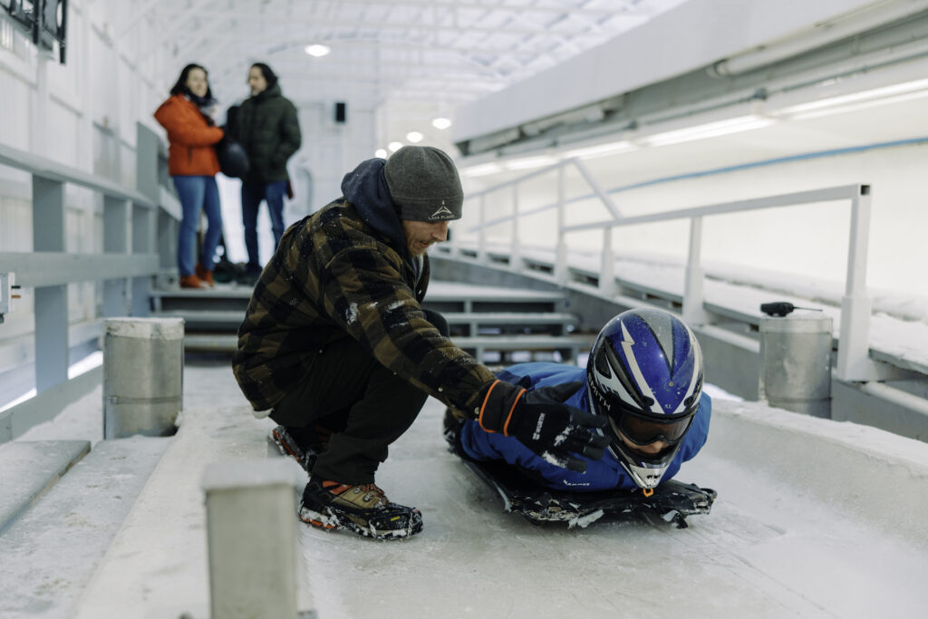 Person preparing to ride the skeleton track at Mt Van Hoevenberg in Lake Placid 