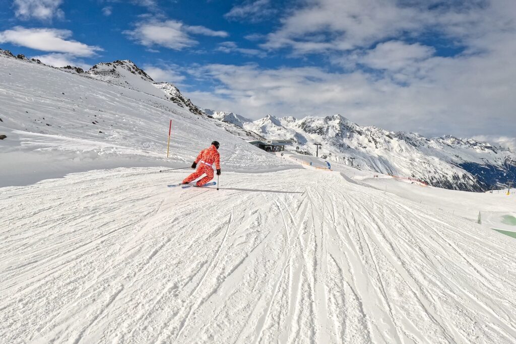 Skiing down groomed run at Sölden in the middle of winter