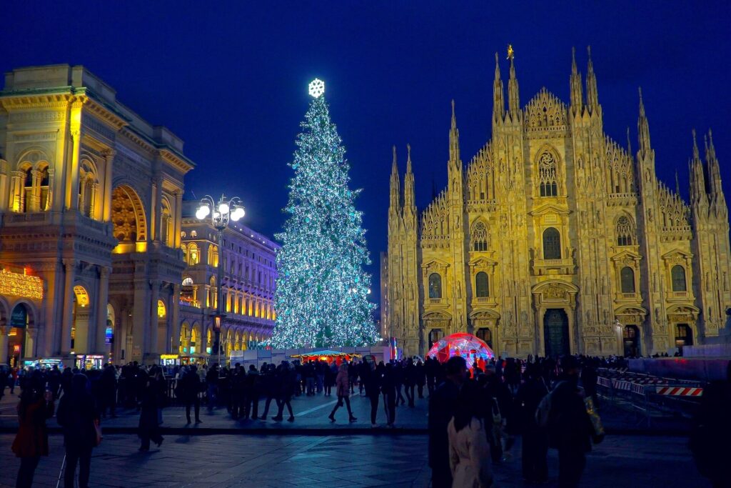 Piazza Duomo in Milan, Italy lit up at night during the holidays