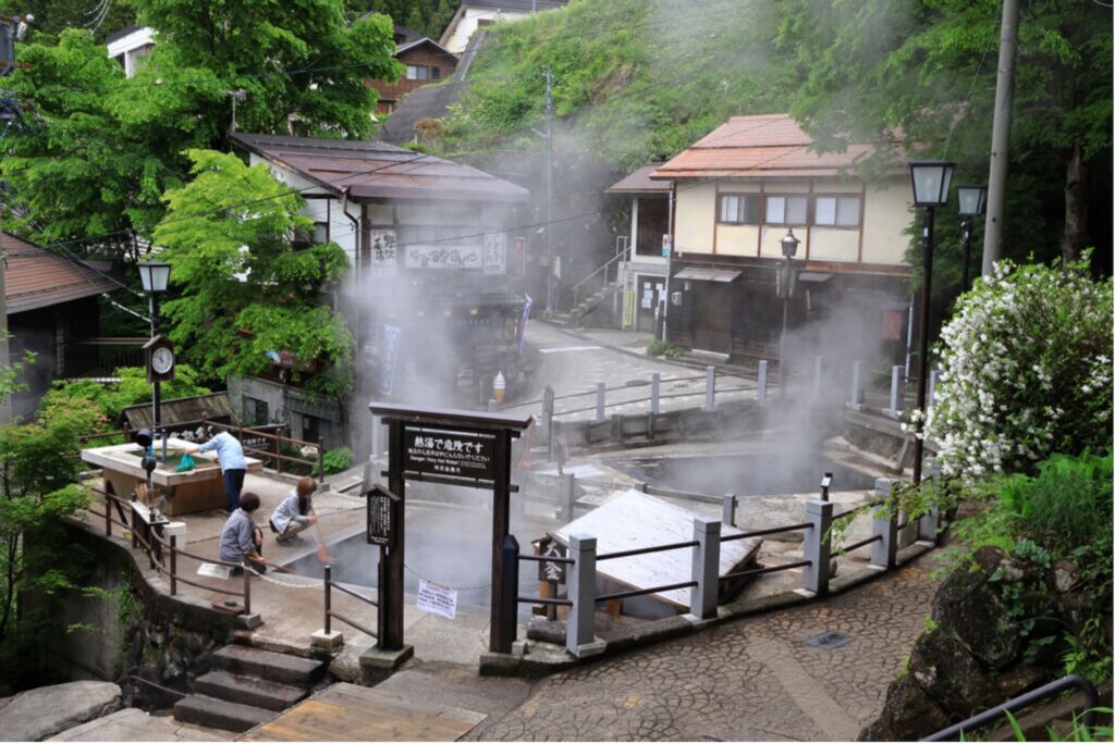 Steam hovering over hot springs at Nozawa Onsen
