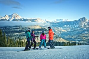 Group of people taking a break on slopes of Purgatory on a sunny day