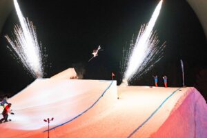 Skiers skiing toward jump for Heavenly Mountain Resort Air & Apres Event